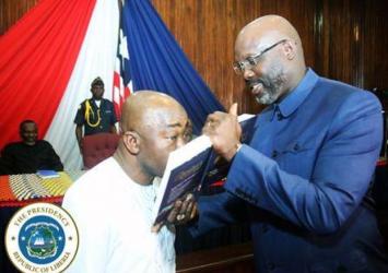 Amb Kemayah kisses Bible affirming allegiance to the sacred officeExecutive Mansion