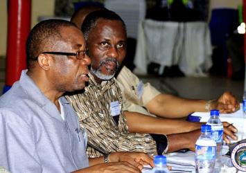 Justice Minister Musa Dean makes presentation as Min McGill listens.EXECUTIVE MANSION