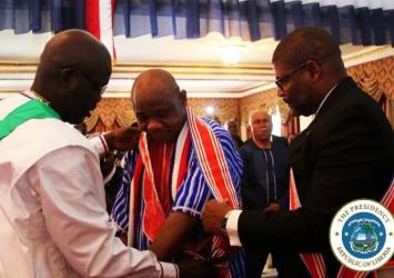 President Weah and Foreign Minister Findley dressing the Independence Day Orator with nation honorEXECUTIVE MANSION