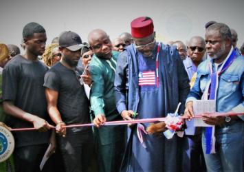 President Weah cutting the ribbon officially dedicating the Doe Community to Clara Town RoadExecutive Mansion