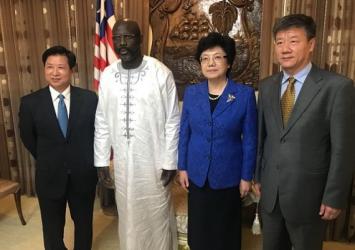 President Weah flanked by Chinese delegation led by Health Minister Li Dequan......Executive Mansion Photo