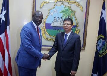 President Weah in a photo shot with the new Chinese Ambassador accredited to Liberia - Fu JinjuExecutive Mansion Photo