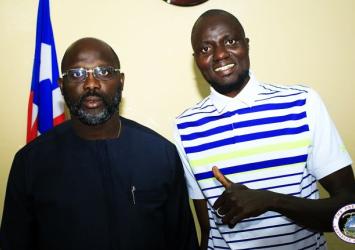 President Weah poses with Mamoudou Toure in his Foreign Ministry Office.EXECUTIVE MANSION