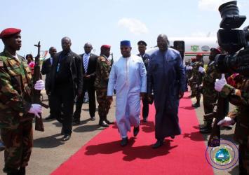 Presidents Weah and Bio walk on the red carpet at the RIA.EXECUTIVE MANSION